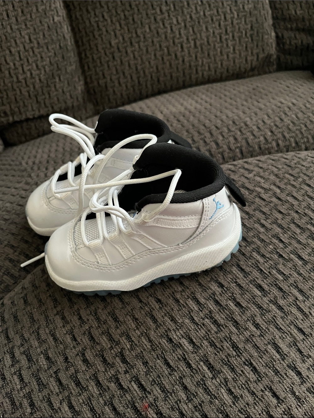 Jordan Kids White Sneakers with Black Collar and Light Blue Detail